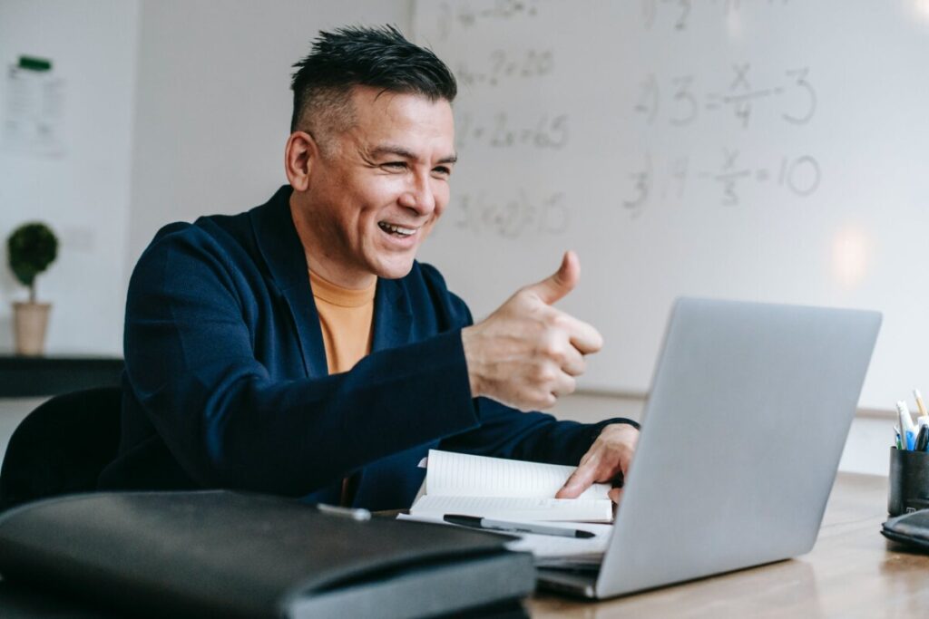 photo of man doing thumbs up